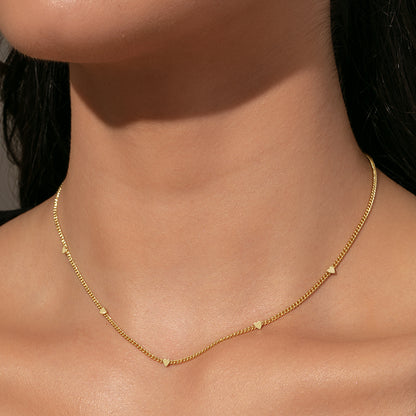 ["Patterned Heart Necklace ", " Gold ", " Model Image ", " Uncommon James"]