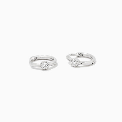 ["Center Stage Huggie Earrings ", " Sterling Silver Clear  ", " Product Detail Image ", " Uncommon James"]