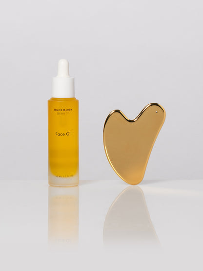 ["Face Oil and Gua Sha Duo ", " Product Image ", " Uncommon Beauty"]