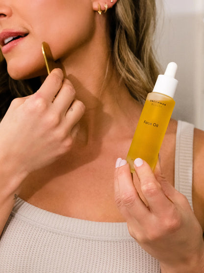 ["Face Oil and Gua Sha Duo ", " Model Image ", " Uncommon Beauty"]