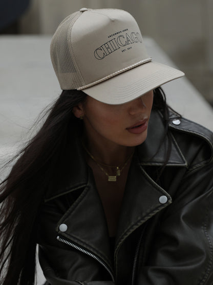 ["Chicago Trucker Hat ", " Beige ", " Model Image ", " Uncommon Lifestyle"]