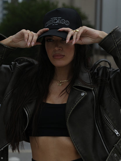 ["Chicago Trucker Hat ", " Black ", " Model Image ", " Uncommon Lifestyle"]