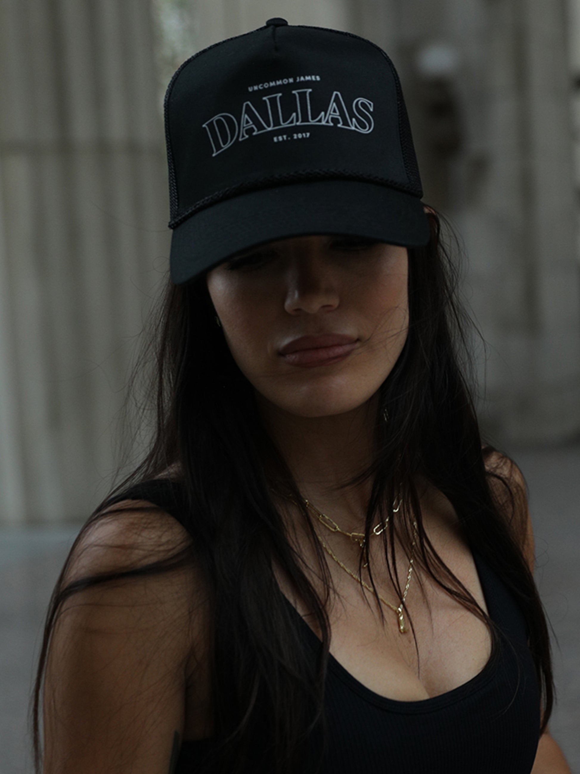 Dallas Trucker Hat | Black | Model Image | Uncommon Lifestyle