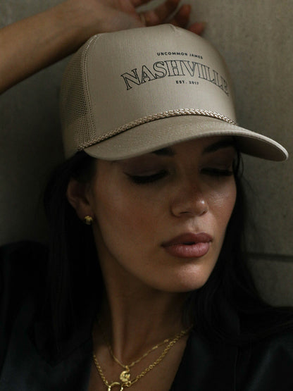 ["Nashville Trucker Hat ", " Beige ", " Model Image ", " Uncommon Lifestyle"]