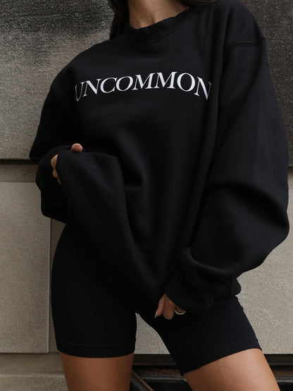 ["Uncommon Sweatshirt ", " Black ", " Model Image 3 ", " Uncommon James"]