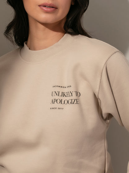 ["Unlikely to Apologize Sweatshirt ", " Beige ", " Model Image 2 ", " Uncommon James"]