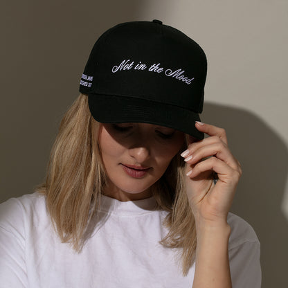 ["Not in the Mood Trucker Hat ", " Black ", " Model Image 2 ", " Uncommon Lifestyle"]