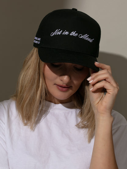 ["Not in the Mood Trucker Hat ", " Black ", " Model Image 2 ", " Uncommon Lifestyle"]