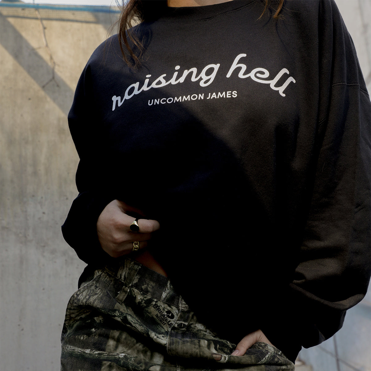 Raising Hell Sweatshirt | Black | Model Image | Uncommon Lifestyle