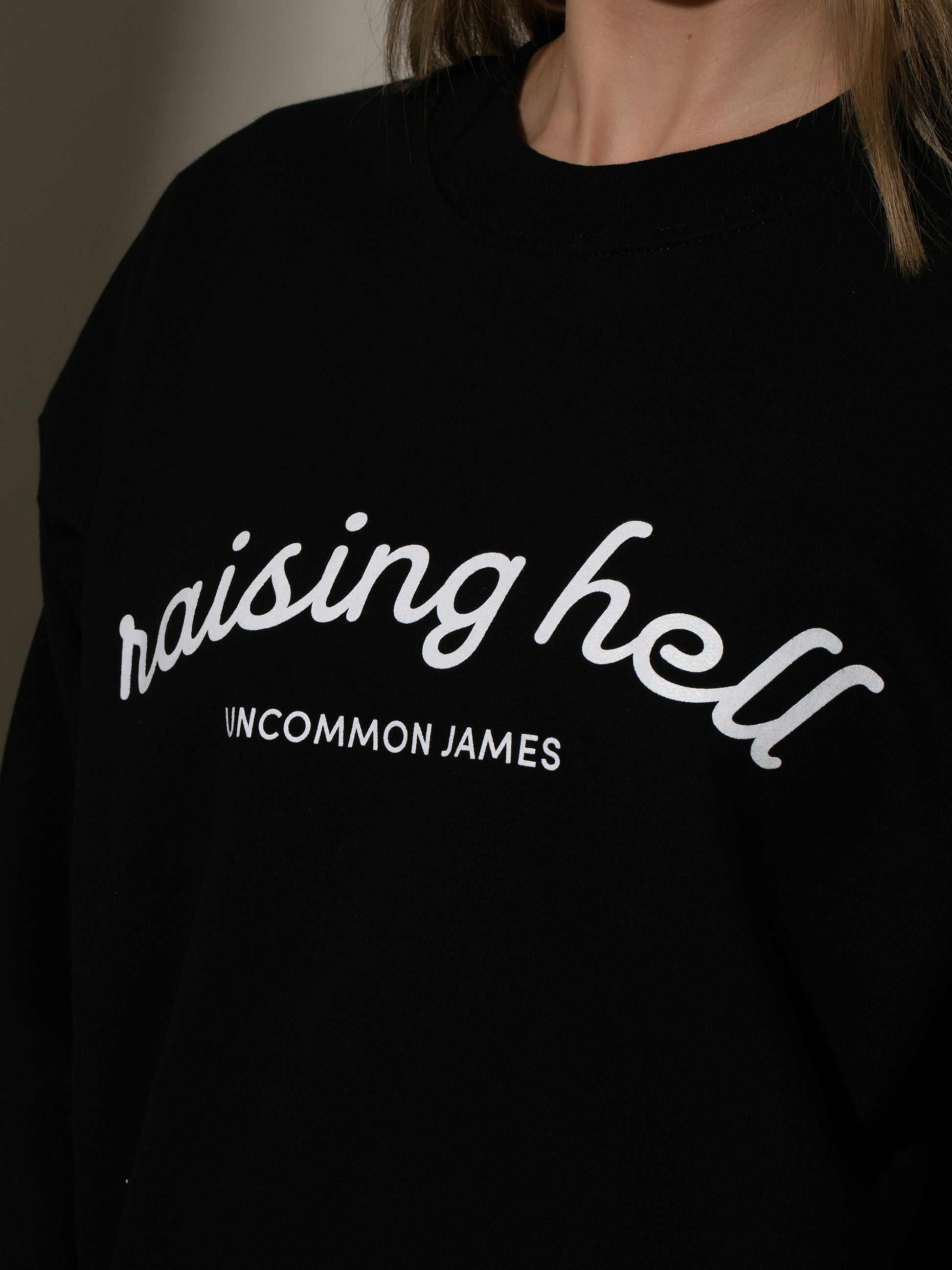 Raising Hell Sweatshirt | Black | Model Image 3 | Uncommon Lifestyle