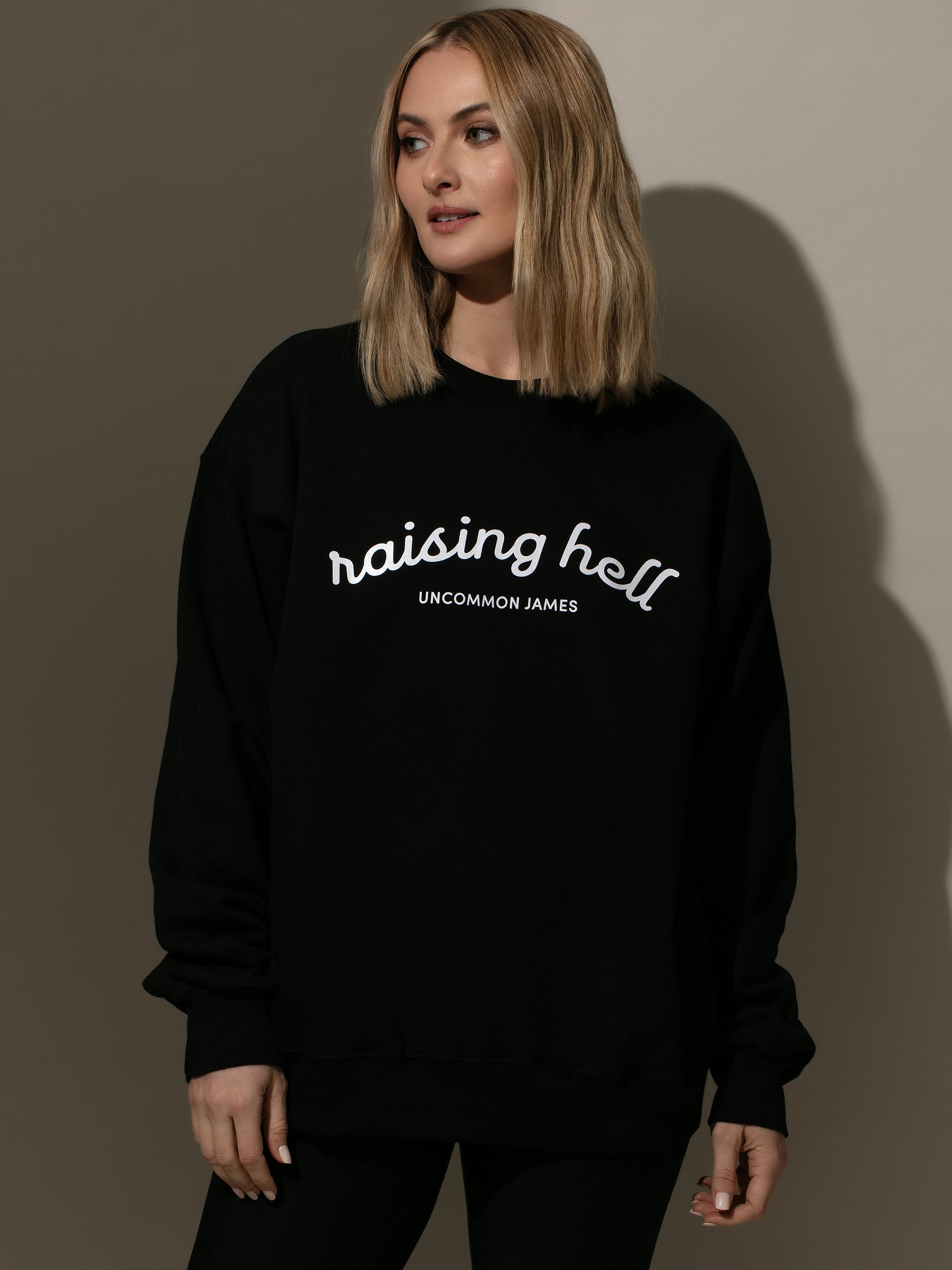 Raising Hell Sweatshirt | Black | Model Image 2 | Uncommon Lifestyle