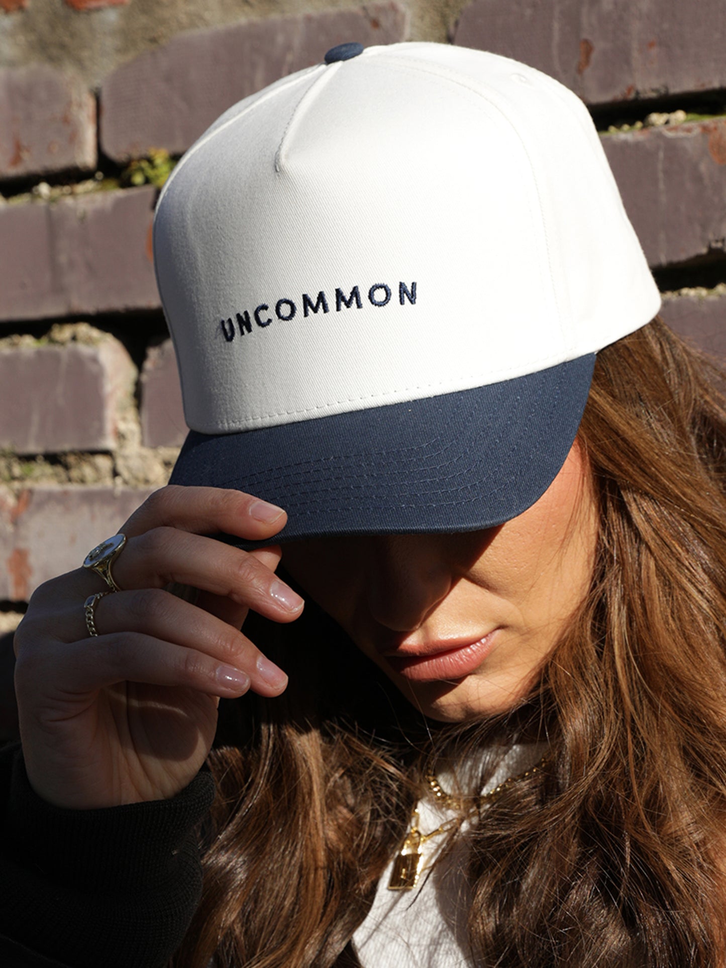 Simple Uncommon Trucker Hat | Navy/Cream | Model Image | Uncommon Lifestyle