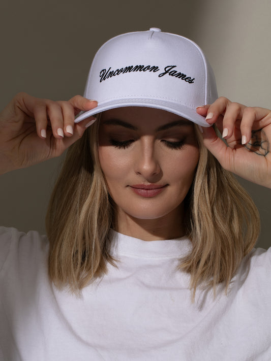 UJ Girl Trucker Hat | White | Model Image 2 | Uncommon Lifestyle