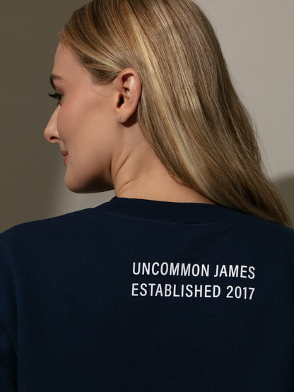 ["Unbothered Sweatshirt ", " Navy ", " Model Image 4 ", " Uncommon Lifestyle"]