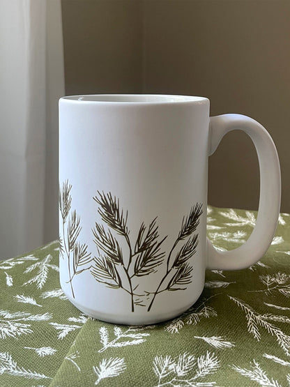 ["Winter Pine Ceramic Mug ", " Lifestyle Image ", " Uncommon James Home"]