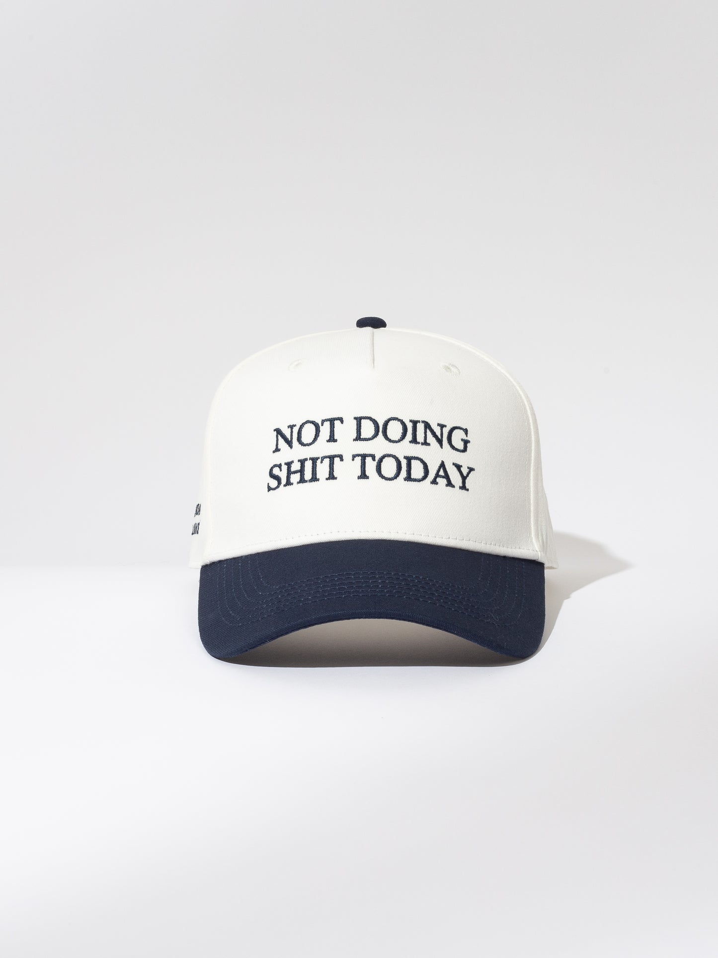 Day Off Trucker Hat | White and Navy | Product Image | Uncommon Lifestyle 