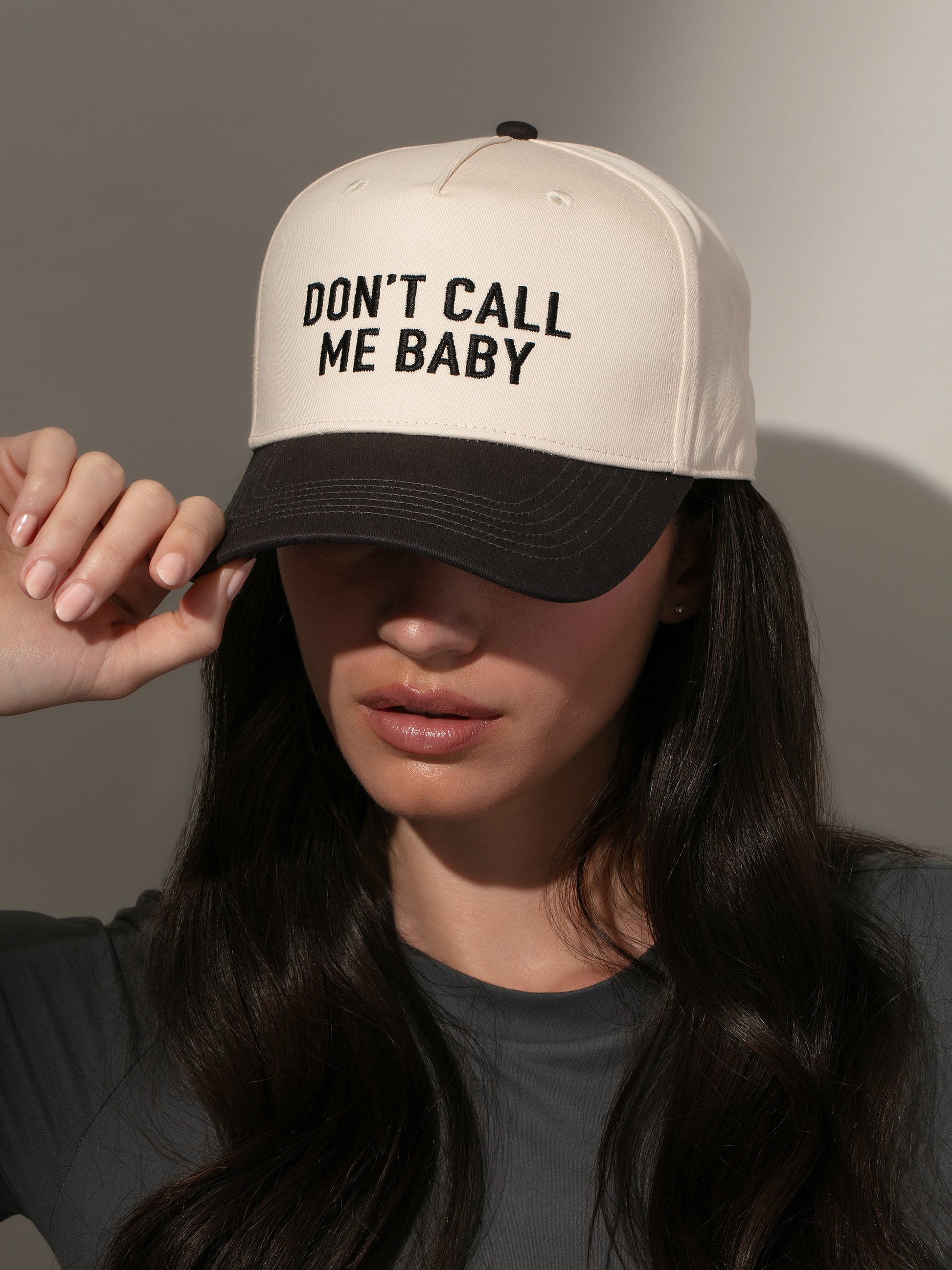 Don't Call Me Baby Trucker Hat | Ivory/Black | Model Image | Uncommon Lifestyle