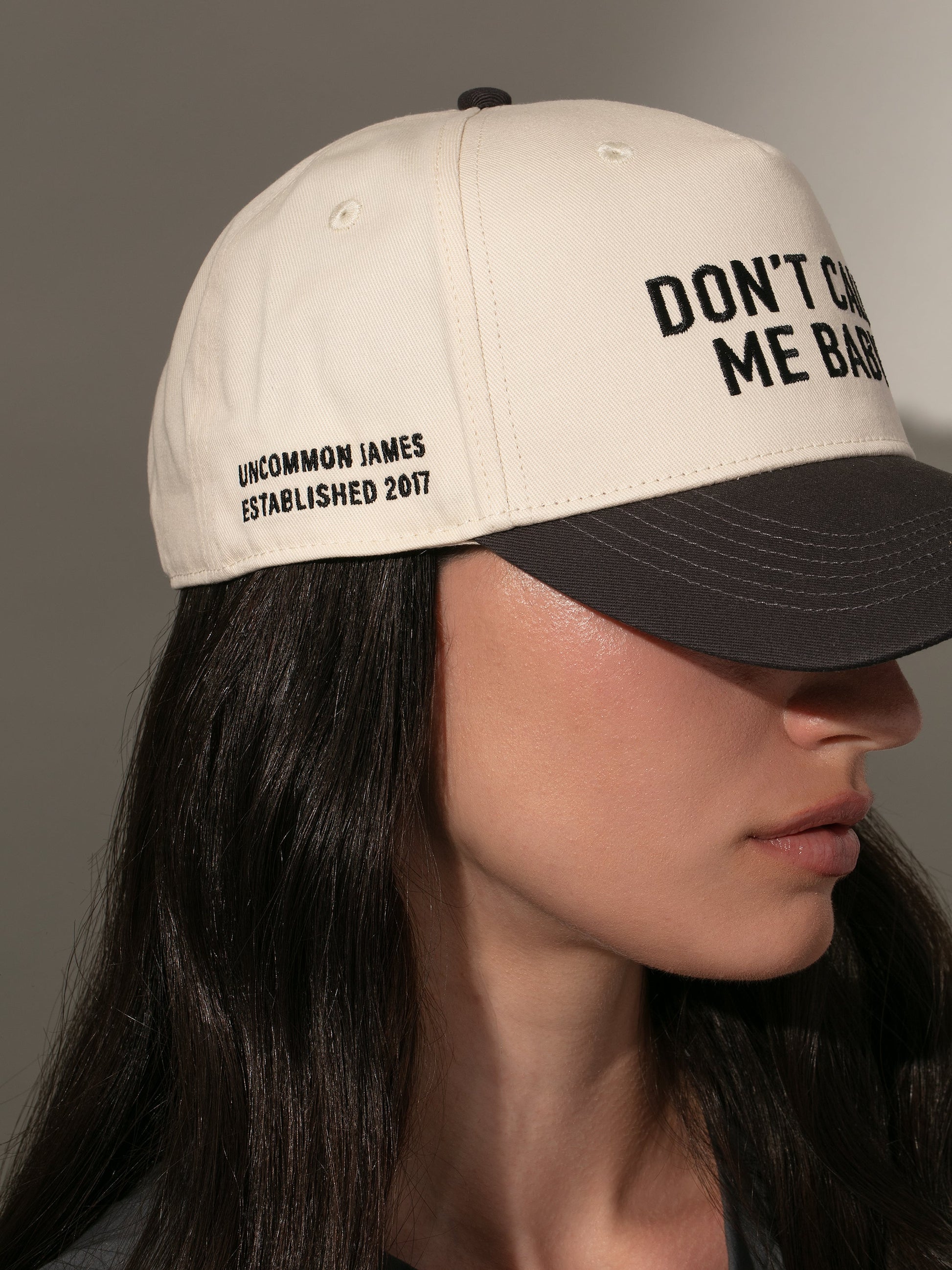 Don't Call Me Baby Trucker Hat | Ivory/Black | Model Image 2 | Uncommon Lifestyle