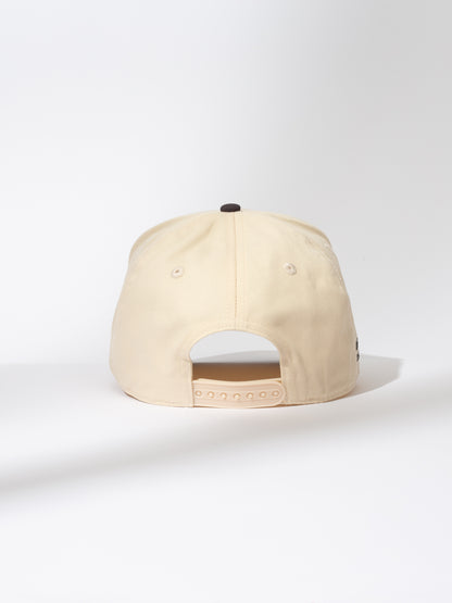 ["Everything But Common Trucker Hat ", " Ivory and Black ", " Product Image ", " Uncommon Lifestyle"]