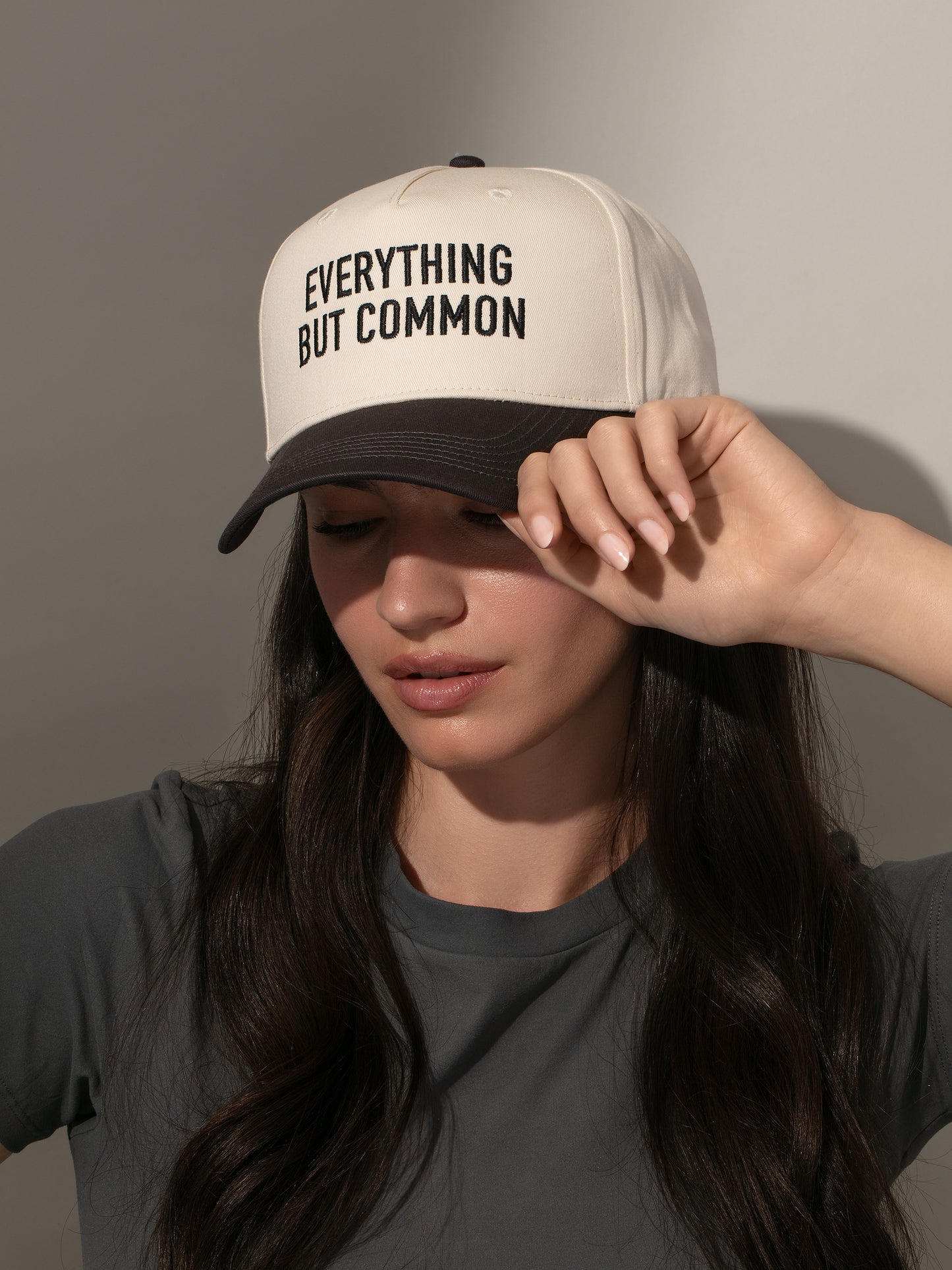 Everything But Common Trucker Hat | Ivory and Black | Model Image | Uncommon Lifestyle