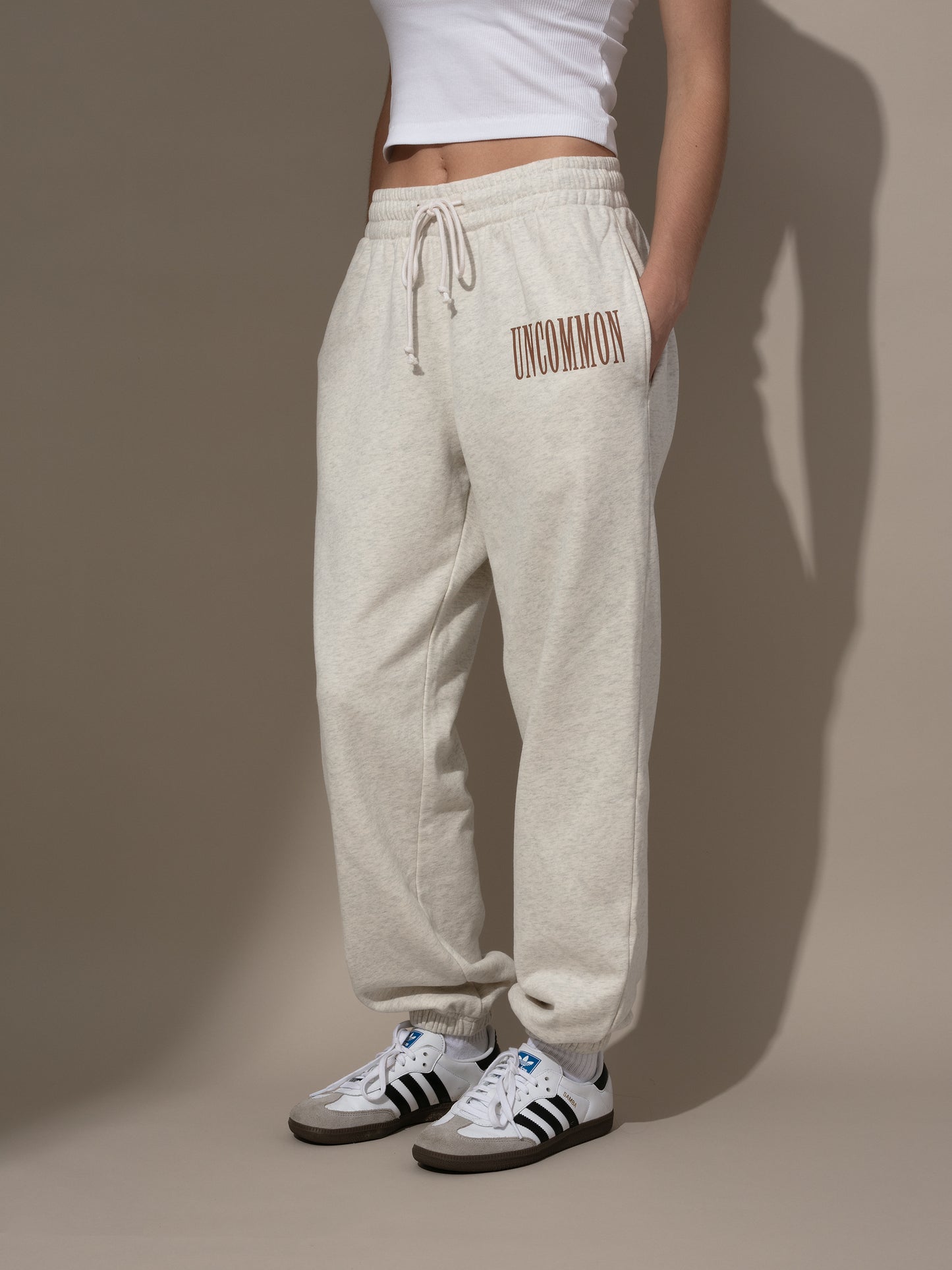 Forever Uncommon Sweatpants | Light Heather Gray and Brown | Model Image | Uncommon Lifestyle