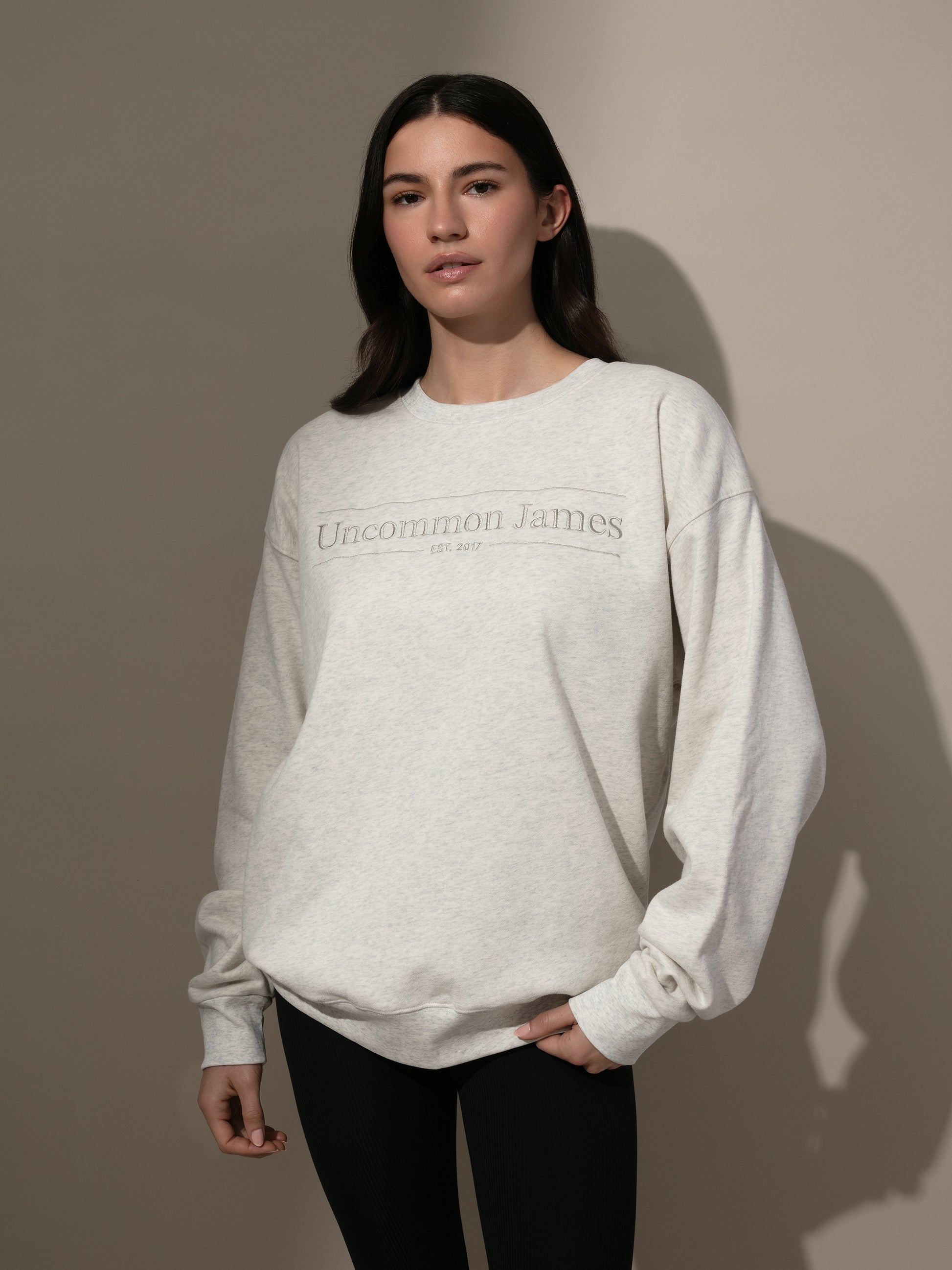 Uncommon James Embroidered Sweatshirt | Heather Gray | Model Image | Uncommon Lifestyle