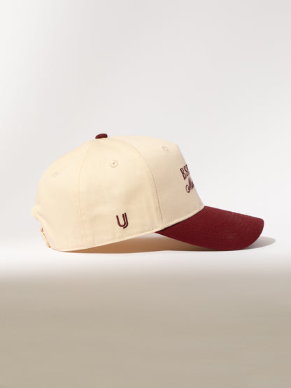 ["Espresso Martini Trucker Hat ", " Burgundy/Tan ", " Product Image ", " Uncommon Lifestyle"]