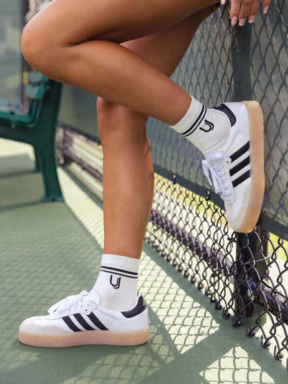 ["UJ Half-Crew Socks ", " White/Black ", " Lifestyle Image ", " Uncommon Lifestyle"]