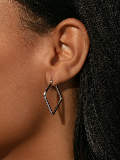 ["Girl Boss Hoop Earrings ", " Sterling Silver Small ", " Model Image ", " Uncommon James"]