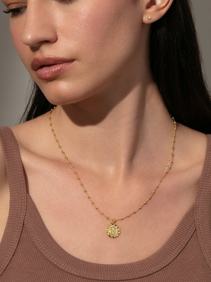 ["Atocha Pendant Necklace ", " Gold Small ", " Model Image ", " Uncommon James"]