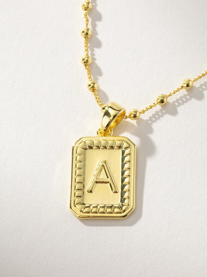 ["Sur Necklace ", " Gold A ", " Product Image ", " Uncommon James"]