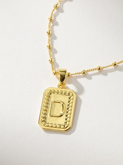 ["Sur Necklace ", " Gold D ", " Product Image ", " Uncommon James"]