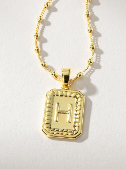 ["Sur Necklace ", " Gold H ", " Product Image ", " Uncommon James"]