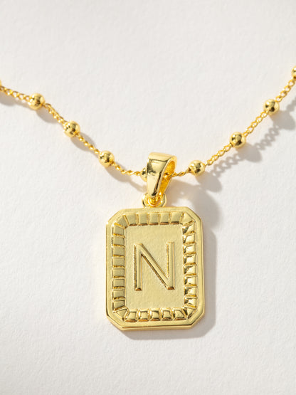 ["Sur Necklace ", " Gold N ", " Product Image ", " Uncommon James"]