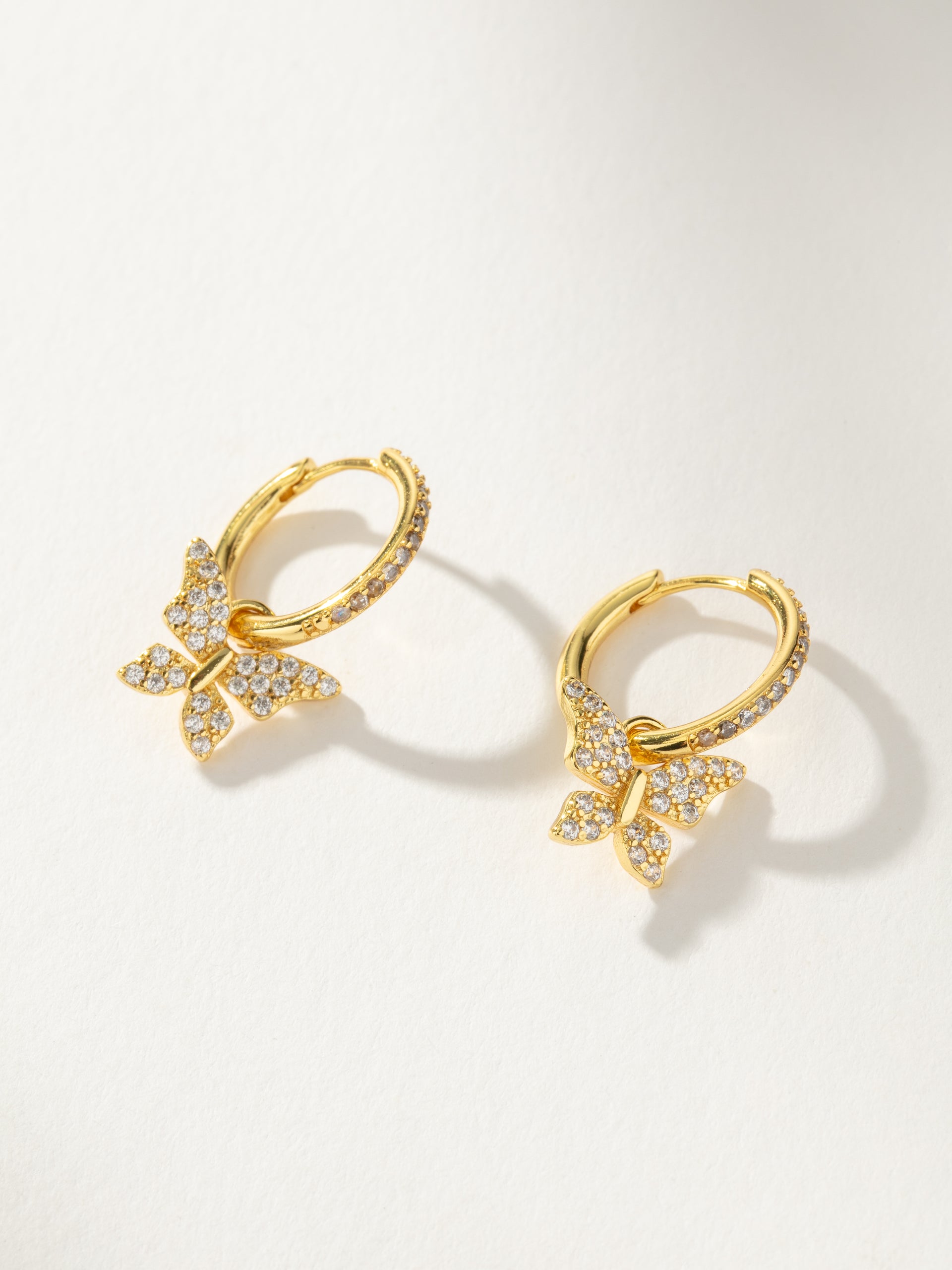 Pavé Butterfly Charm Huggie Earrings in Gold Uncommon James