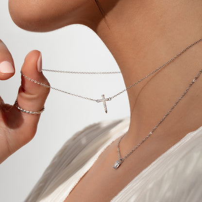 ["Simple Cross Necklace ", " Sterling Silver ", " Model Image ", " Uncommon James"]