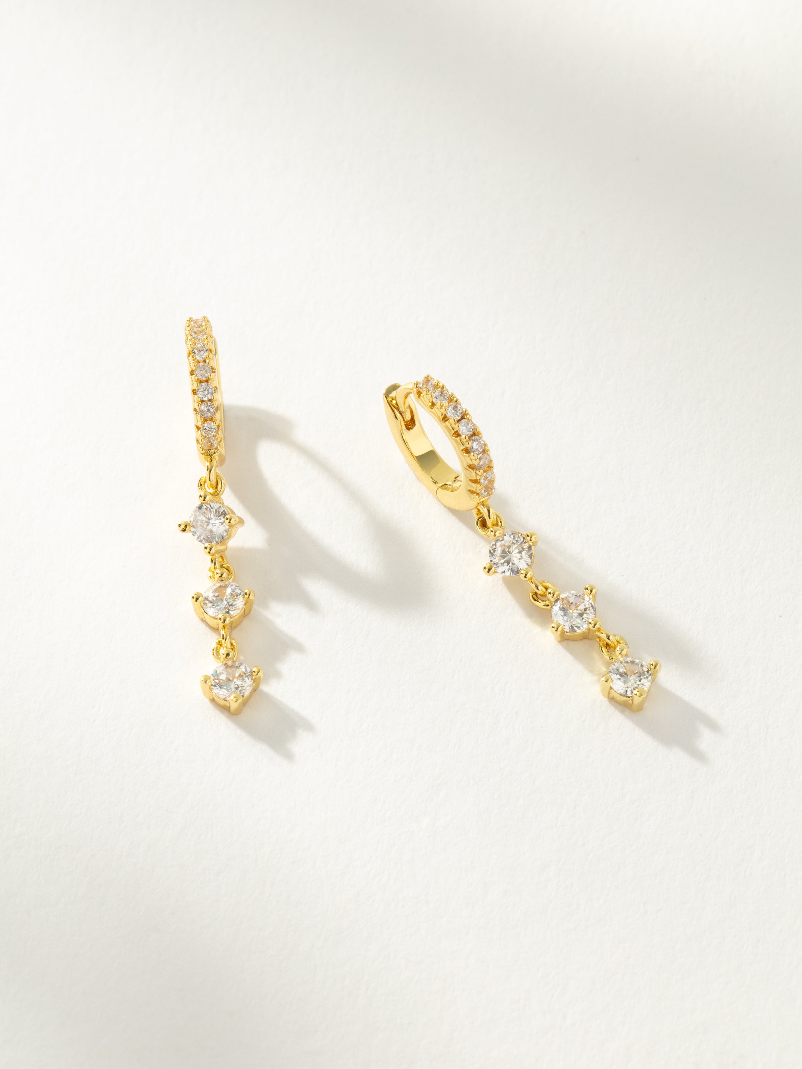 Charmed Pave Dangle Huggie Earrings in Gold Uncommon James