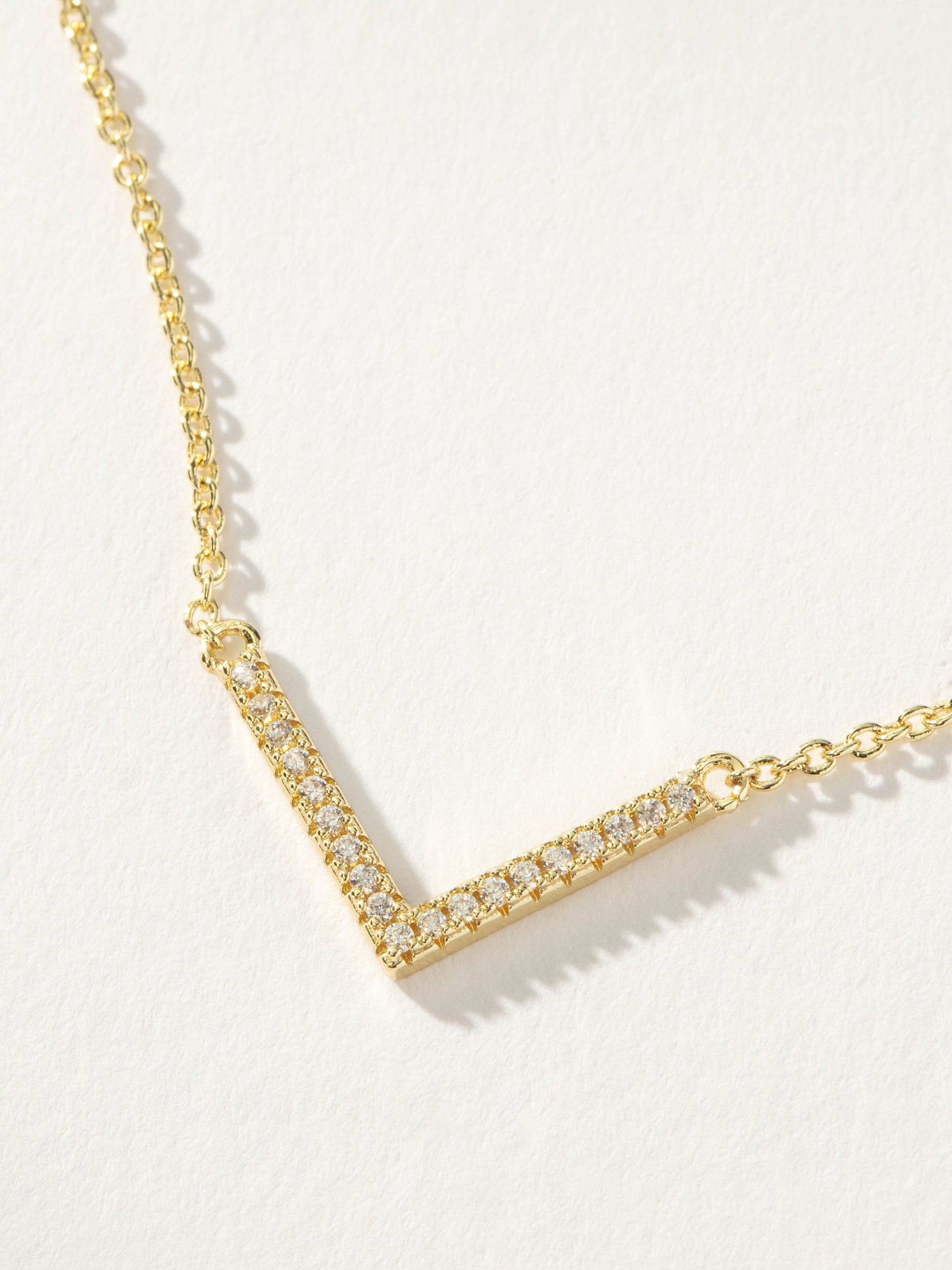 Baby V Necklace | Gold Clear | Product Detail Image | Uncommon James