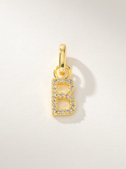 ["Pavé Letter Charm ", " Gold B ", " Product Image ", " Uncommon James"]