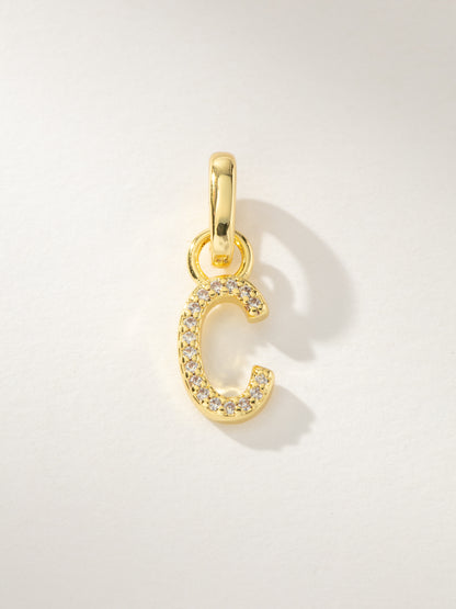 ["Pavé Letter Charm ", " Gold C ", " Product Image ", " Uncommon James"]