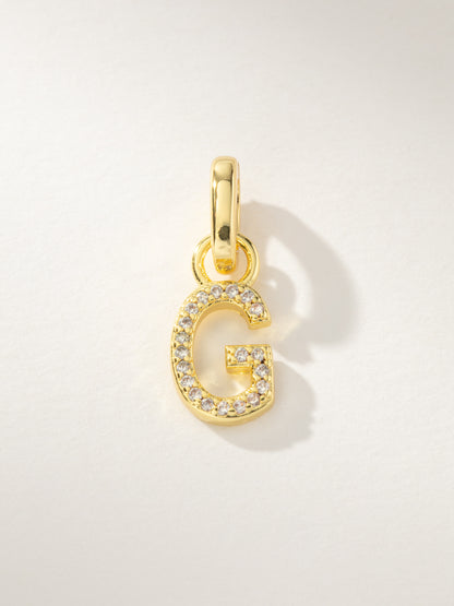 ["Pavé Letter Charm ", " Gold G ", " Product Image ", " Uncommon James"]