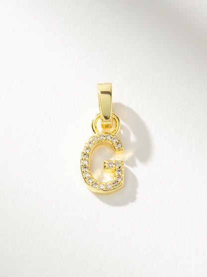 ["Letter Charm ", " Pavé Gold G ", " Product Image ", " Uncommon James"]