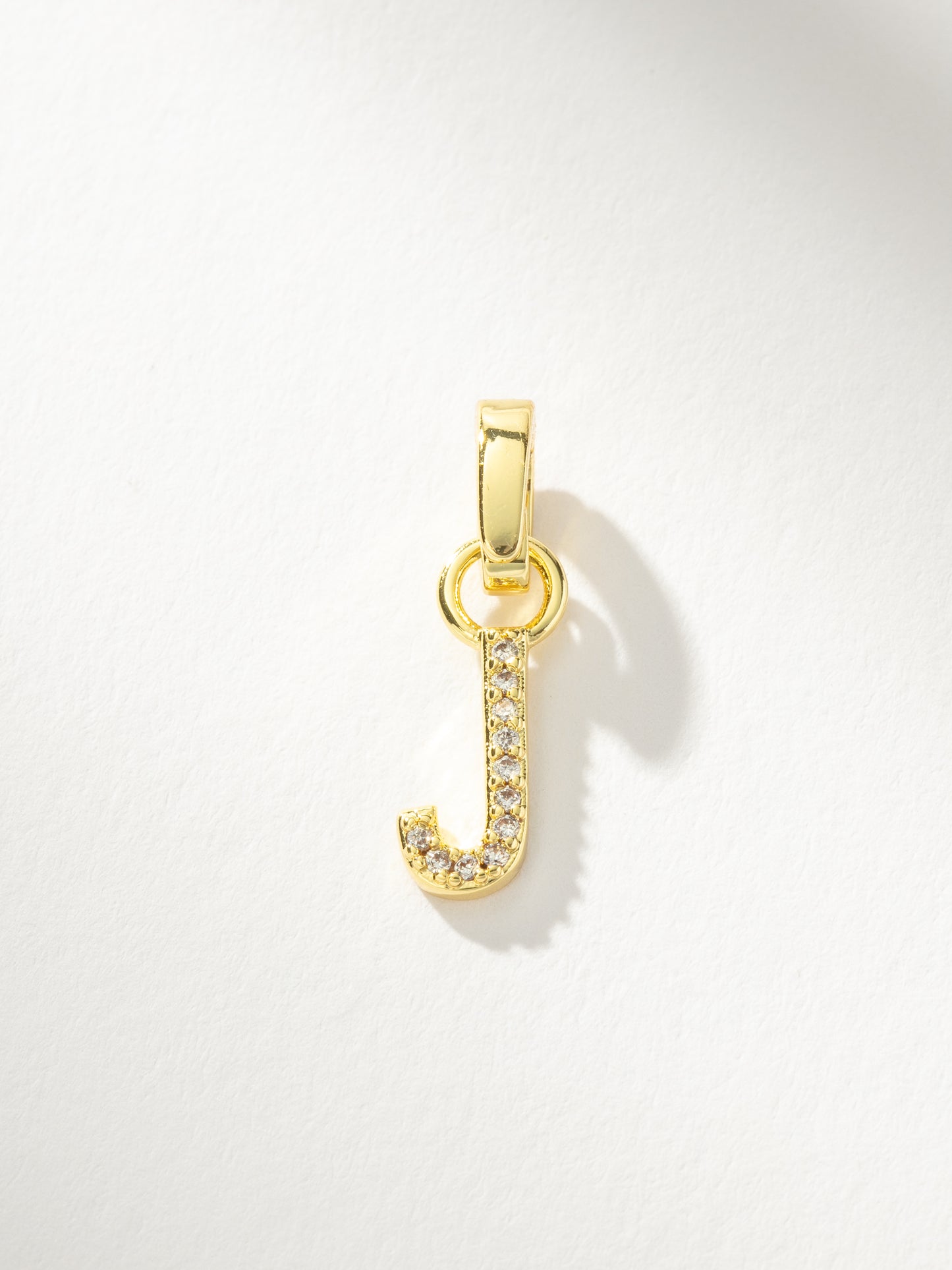 Letter Charm | Gold Clear J | Product Image | Uncommon James