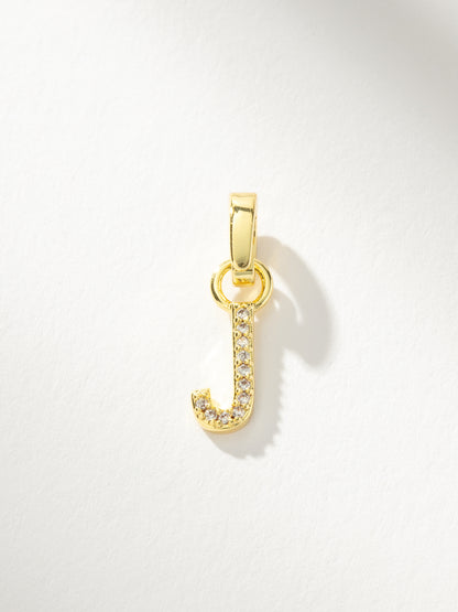["Letter Charm ", " Gold Clear J ", " Product Image ", " Uncommon James"]