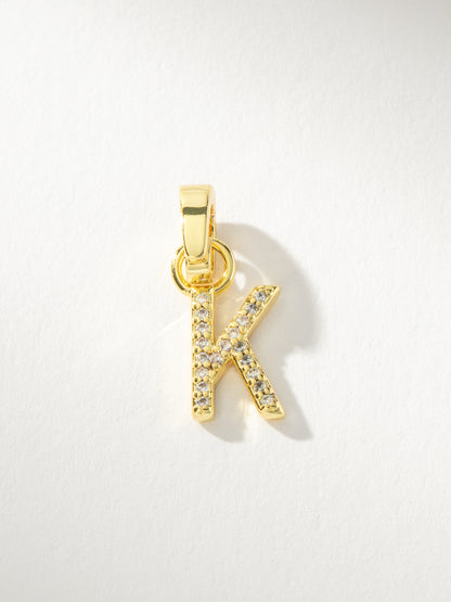 ["Letter Charm ", " Pavé Gold K ", " Product Image ", " Uncommon James"]