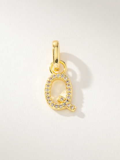 ["Pavé Letter Charm ", " Gold Q ", " Product Image ", " Uncommon James"]