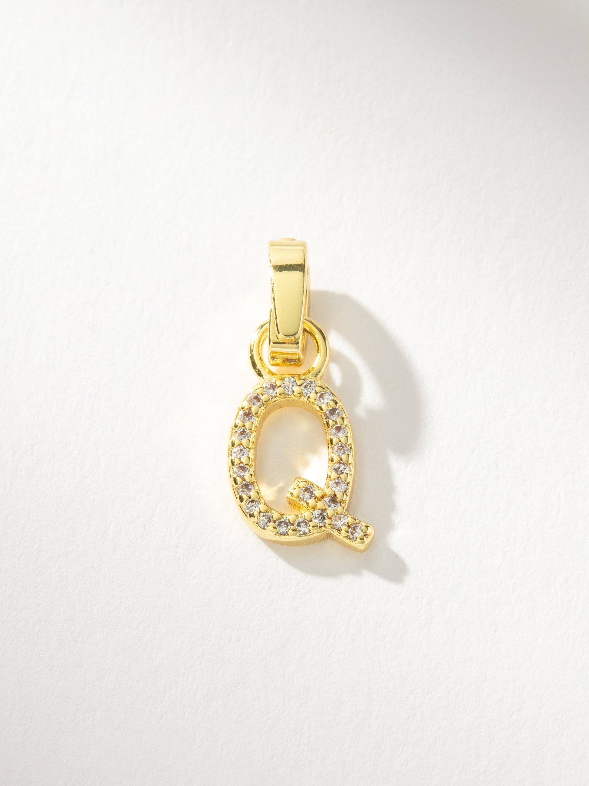 Letter Charm | Gold Clear Q | Product Image | Uncommon James