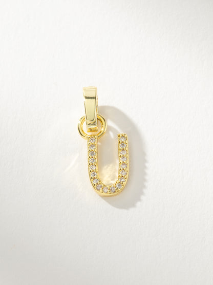 ["Letter Charm ", " Gold Clear U ", " Product Image ", " Uncommon James"]