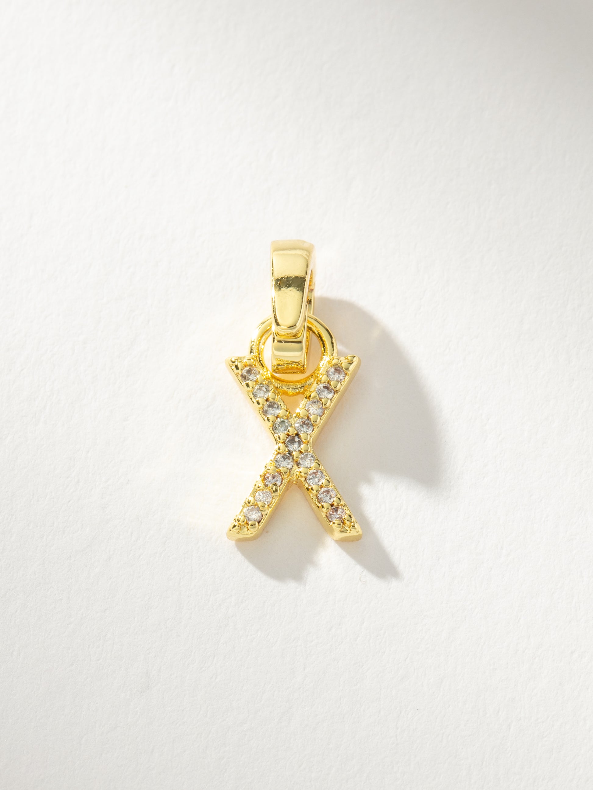 Letter Charm | Gold Clear X | Product Image | Uncommon James