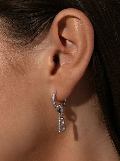 ["Pavé Letter Charm ", " Silver ", " Model Image ", " Uncommon James"]